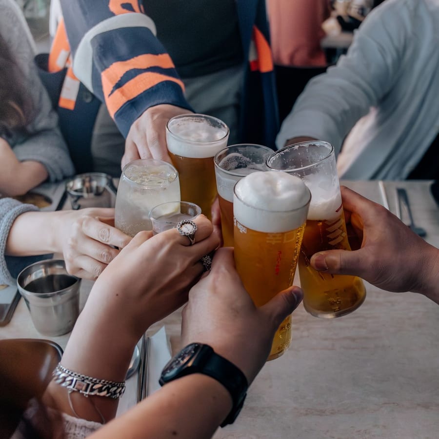 Friends toasting with drinks at a gathering